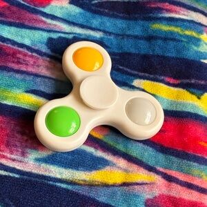 White Kids Fidget Spinner with Yellow, Green & Gray Dots